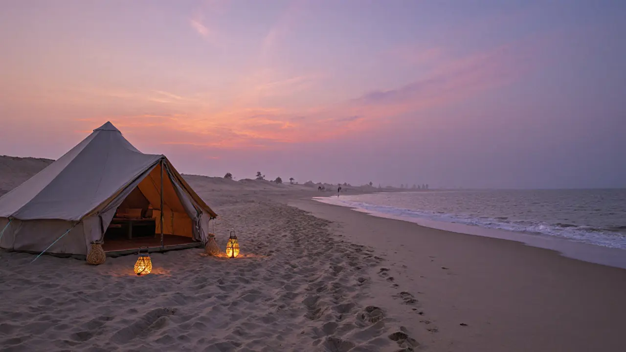 Secluded beach tent at twilight with lanterns and footprints leading to the ocean.