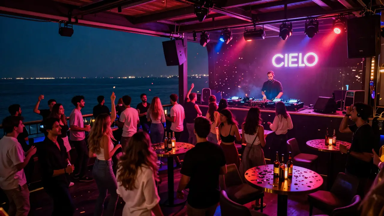 Crowd dancing at a neon-lit beachfront nightclub in Dubai under open stars.